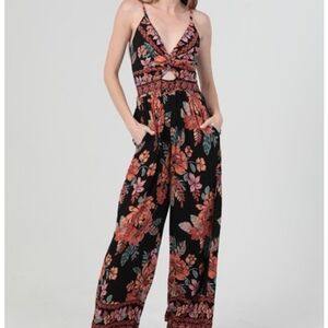 Angie Black Jumpsuit with Orange Floral Design